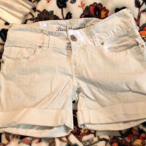 White cuffed shorts.
